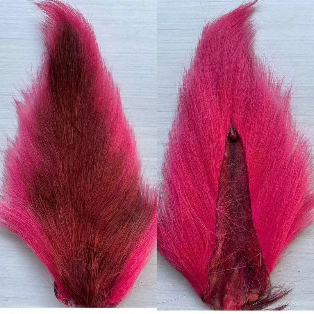WBQ Tackle supplies Superse Bucktail Fur in bright pink and deep red, natural material for fly tying.