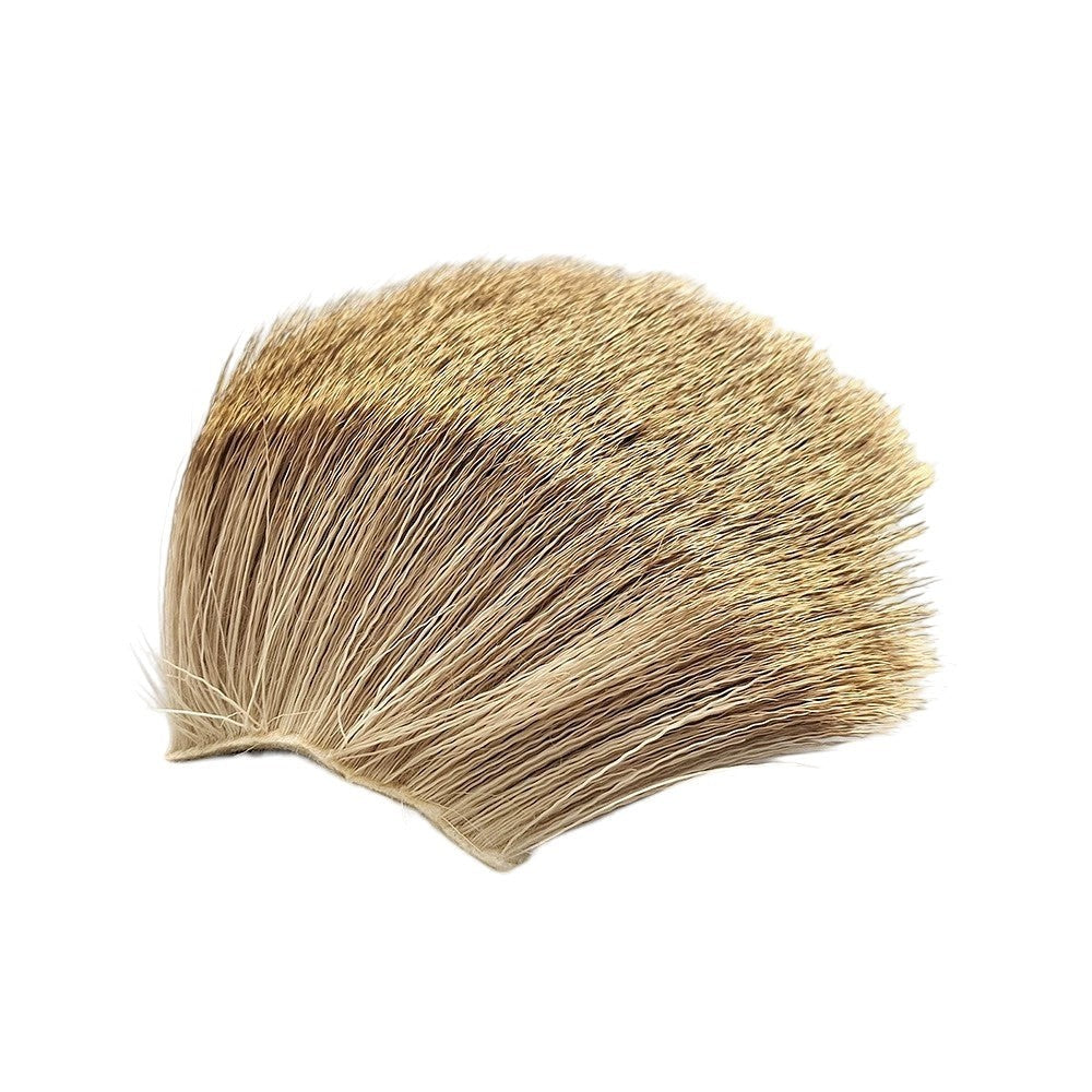 WBQ Tackle supplies Superse deer fur fly tying material in natural tan and brown hues, ideal for nymphs and streamers.