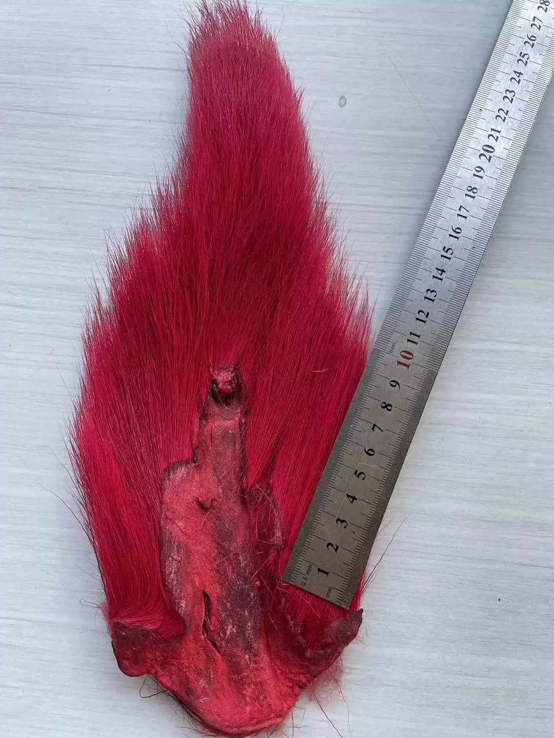 WBQ Tackle supplies bright red bucktail fur for fly tying and fishing lures. Natural animal fur.